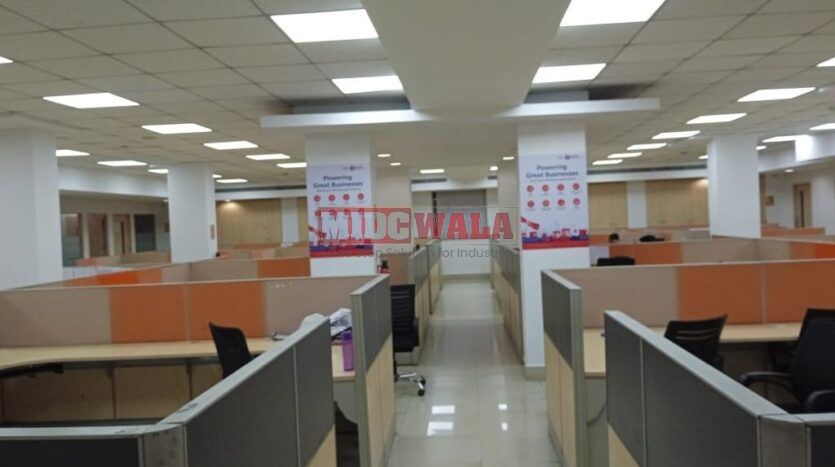 An image showcasing a fully furnished office space in MBP Mahape, Navi Mumbai, featuring modern workstations, well-appointed conference rooms, and a vibrant work environment.