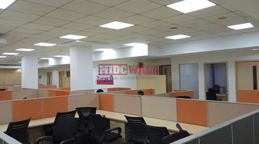 An image showcasing a fully furnished office space in MBP Mahape, Navi Mumbai, featuring modern workstations, well-appointed conference rooms, and a vibrant work environment.