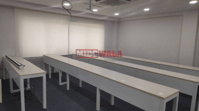 An image showcasing a fully furnished office space in MBP Mahape, Navi Mumbai, featuring modern workstations, well-appointed conference rooms, and a vibrant work environment.