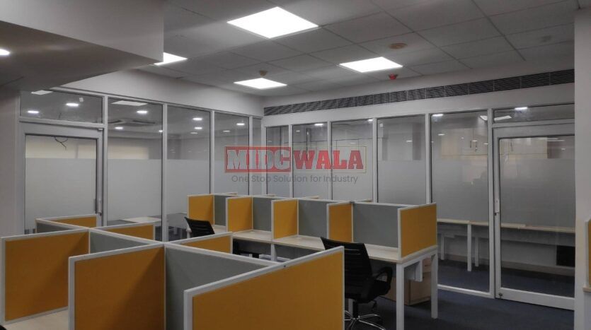 An image showcasing a fully furnished office space in MBP Mahape, Navi Mumbai, featuring modern workstations, well-appointed conference rooms, and a vibrant work environment.