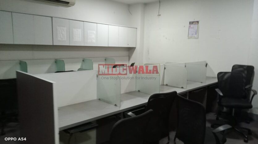 An image showcasing a office space in MBP, Mahape, Navi Mumbai, featuring modern workstations, well-appointed conference rooms, and a vibrant work environment.