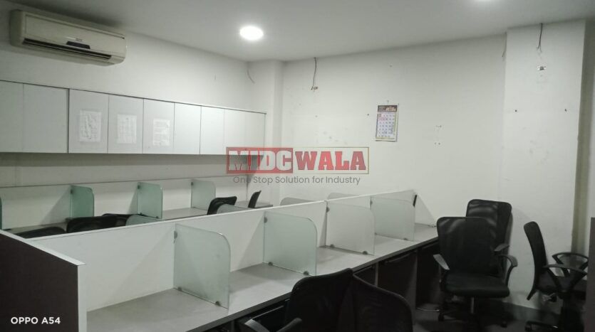 An image showcasing a office space in MBP, Mahape, Navi Mumbai, featuring modern workstations, well-appointed conference rooms, and a vibrant work environment.