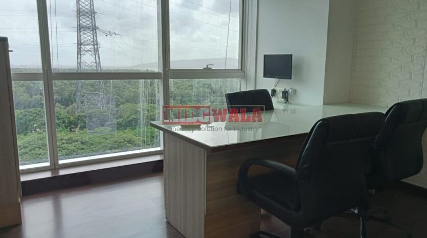 An image showcasing a fully furnished office space at Kesar Solitaire, Palm Beach Road, Navi Mumbai, featuring modern workstations, well-appointed conference rooms, and a vibrant work environment.