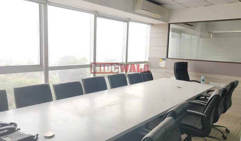 An image showcasing a fully furnished office space at Kesar Solitaire, Palm Beach Road, Navi Mumbai, featuring modern workstations, well-appointed conference rooms, and a vibrant work environment.