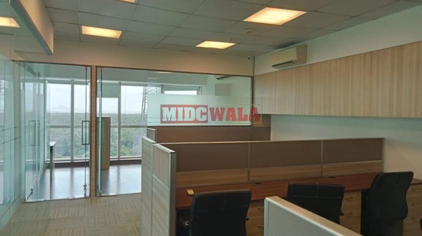 An image showcasing a fully furnished office space at Kesar Solitaire, Palm Beach Road, Navi Mumbai, featuring modern workstations, well-appointed conference rooms, and a vibrant work environment.