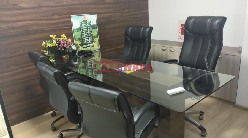 An image showcasing a fully furnished office space at Kesar Solitaire, Palm Beach Road, Navi Mumbai, featuring modern workstations, well-appointed conference rooms, and a vibrant work environment.