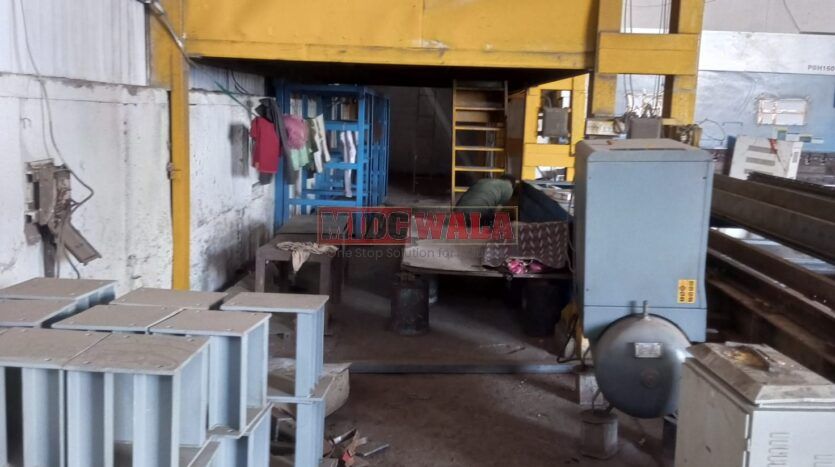 spacious and well-maintained industrial shed available for lease in Rabale, Navi Mumbai's TTC Industrial Area. The shed features ample workspace, ample power supply, and convenient access to transportation.