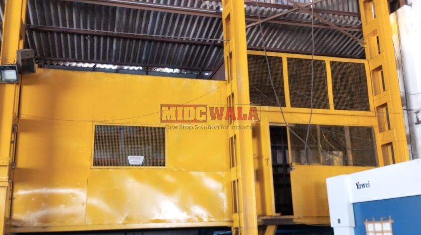 spacious and well-maintained industrial shed available for lease in Rabale, Navi Mumbai's TTC Industrial Area. The shed features ample workspace, ample power supply, and convenient access to transportation.