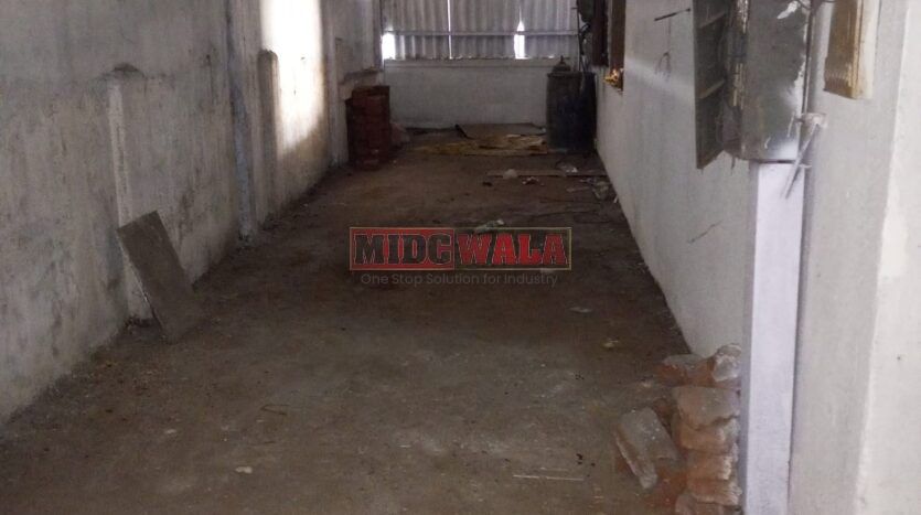 spacious and well-maintained industrial shed available for lease in Rabale, Navi Mumbai's TTC Industrial Area. The shed features ample workspace, ample power supply, and convenient access to transportation.