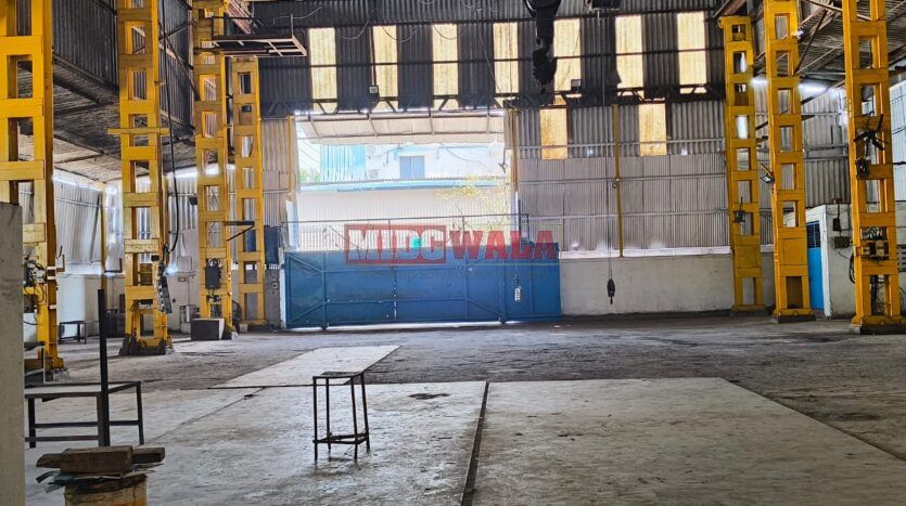 spacious and well-maintained industrial shed available for lease in Rabale, Navi Mumbai's TTC Industrial Area. The shed features ample workspace, ample power supply, and convenient access to transportation.