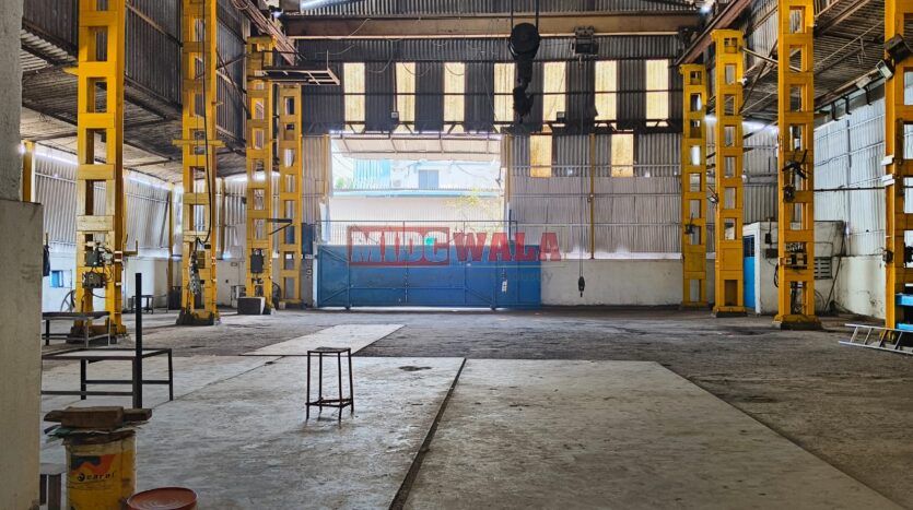 spacious and well-maintained industrial shed available for lease in Rabale, Navi Mumbai's TTC Industrial Area. The shed features ample workspace, ample power supply, and convenient access to transportation.