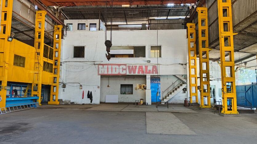 spacious and well-maintained industrial shed available for lease in Rabale, Navi Mumbai's TTC Industrial Area. The shed features ample workspace, ample power supply, and convenient access to transportation.