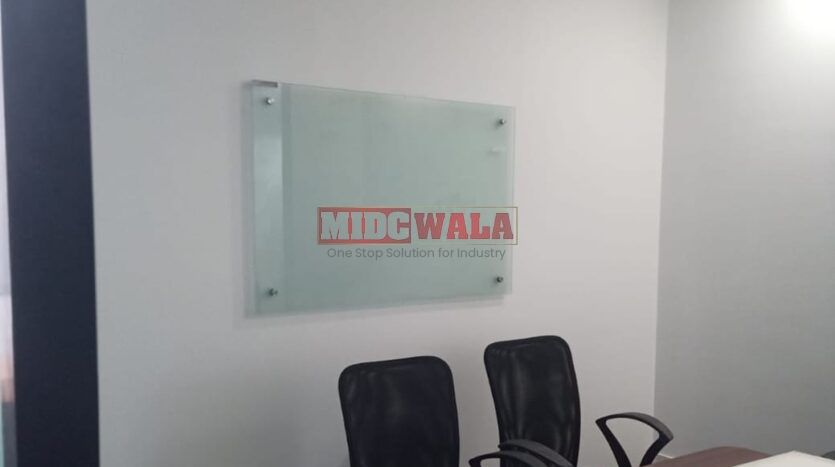 An image showcasing a fully furnished office space in, MBP, Mahape, Navi Mumbai, featuring modern workstations, well-appointed conference rooms, and a vibrant work environment.