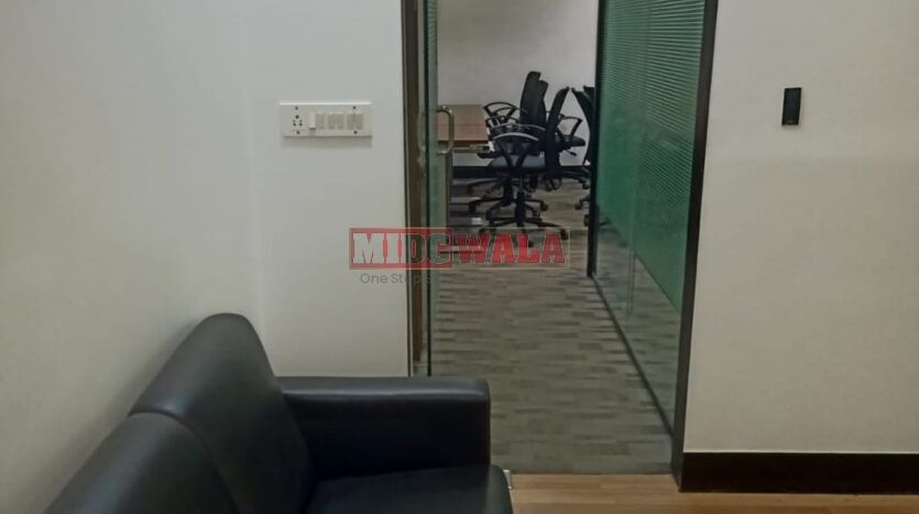 An image showcasing a fully furnished office space in, MBP, Mahape, Navi Mumbai, featuring modern workstations, well-appointed conference rooms, and a vibrant work environment.