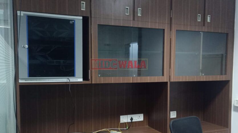 An image showcasing a fully furnished office space in, MBP, Mahape, Navi Mumbai, featuring modern workstations, well-appointed conference rooms, and a vibrant work environment.