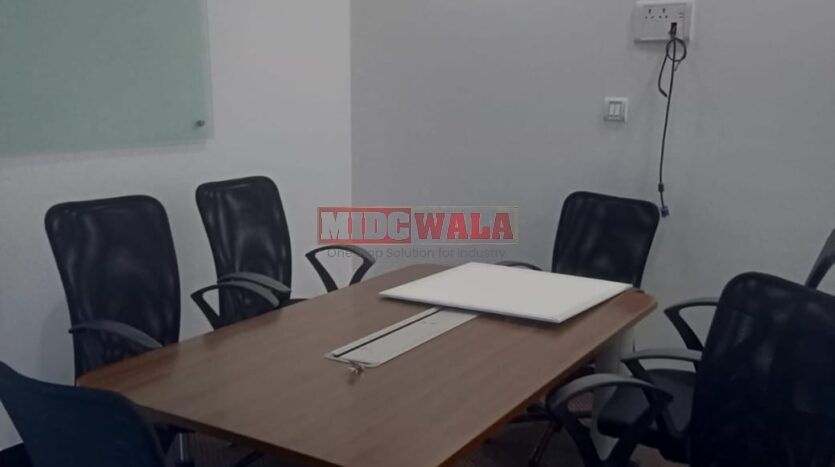 An image showcasing a fully furnished office space in, MBP, Mahape, Navi Mumbai, featuring modern workstations, well-appointed conference rooms, and a vibrant work environment.