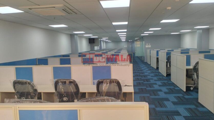 An image showcasing a fully furnished office space at Akshar Business Park, Vashi, Navi Mumbai, featuring modern workstations, well-appointed conference rooms, and a vibrant work environment.