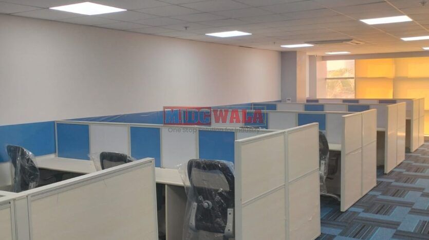 An image showcasing a fully furnished office space at Akshar Business Park, Vashi, Navi Mumbai, featuring modern workstations, well-appointed conference rooms, and a vibrant work environment.