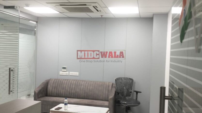 An image showcasing a fully furnished office space at Rupa Solitaire, MBP, Mahape, Navi Mumbai, featuring modern workstations, well-appointed conference rooms, and a vibrant work environment.