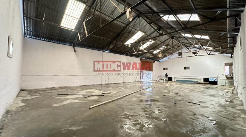 Spacious industrial warehouse available for lease in Mahape, Navi Mumbai, offering ample space for production, storage, and distribution. (MIDCWALA )