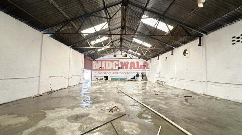 Spacious industrial warehouse available for lease in Mahape, Navi Mumbai, offering ample space for production, storage, and distribution. (MIDCWALA )