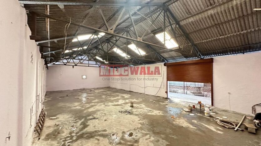 Spacious industrial warehouse available for lease in Mahape, Navi Mumbai, offering ample space for production, storage, and distribution. (MIDCWALA )