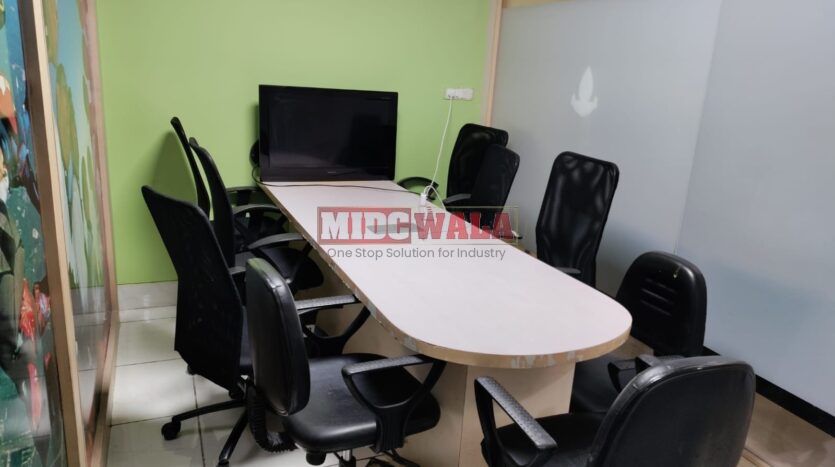 An image showcasing a fully furnished office space at Aryan Business, MBP, Mahape, Navi Mumbai, featuring modern workstations, well-appointed conference rooms, and a vibrant work environment.