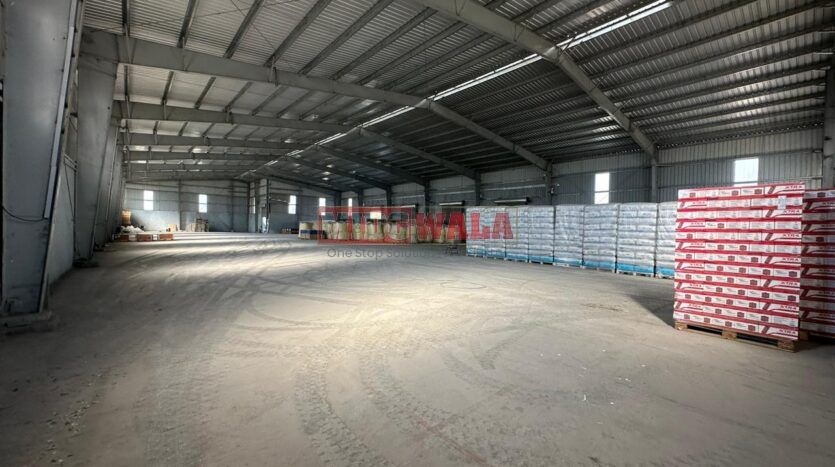 Spacious industrial warehouse available for lease in JNPT, Navi Mumbai, offering ample space for production, storage, and distribution. (MIDCWALA )