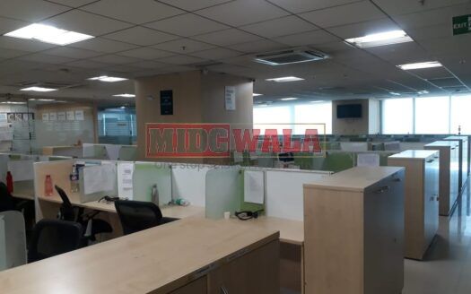 Photo of a professional office workspace with desks, chairs, and equipment, ready for immediate occupancy in Mahape, Navi Mumbai.