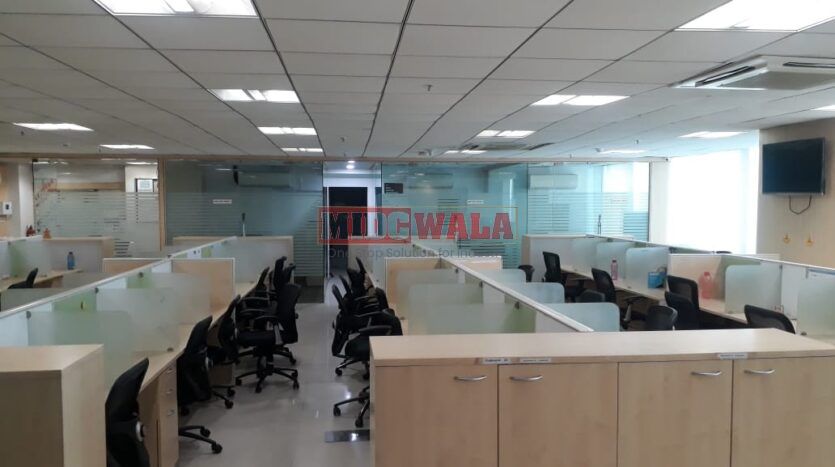 Photo of a professional office workspace with desks, chairs, and equipment, ready for immediate occupancy in Mahape, Navi Mumbai.