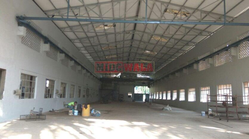 large industrial shed with overhead doors and loading dock in Nerul MIDC, Navi Mumbai.