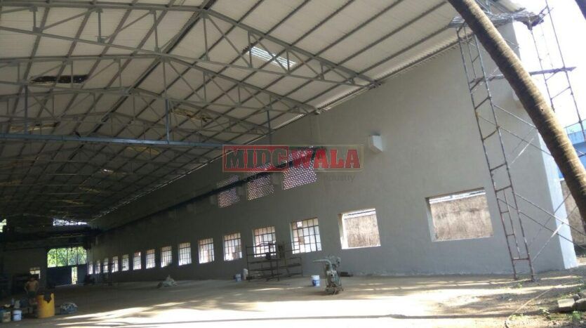 large industrial shed with overhead doors and loading dock in Nerul MIDC, Navi Mumbai.