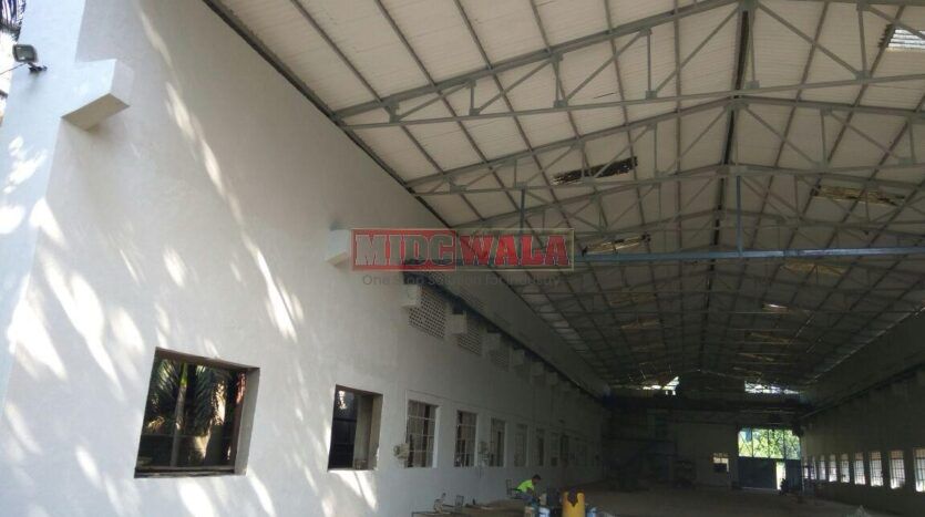 large industrial shed with overhead doors and loading dock in Nerul MIDC, Navi Mumbai.