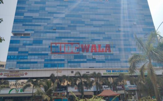 A modern, glass-fronted office building in Ulwe, India, with a sign advertising "Ready-to-move-in office space for sale